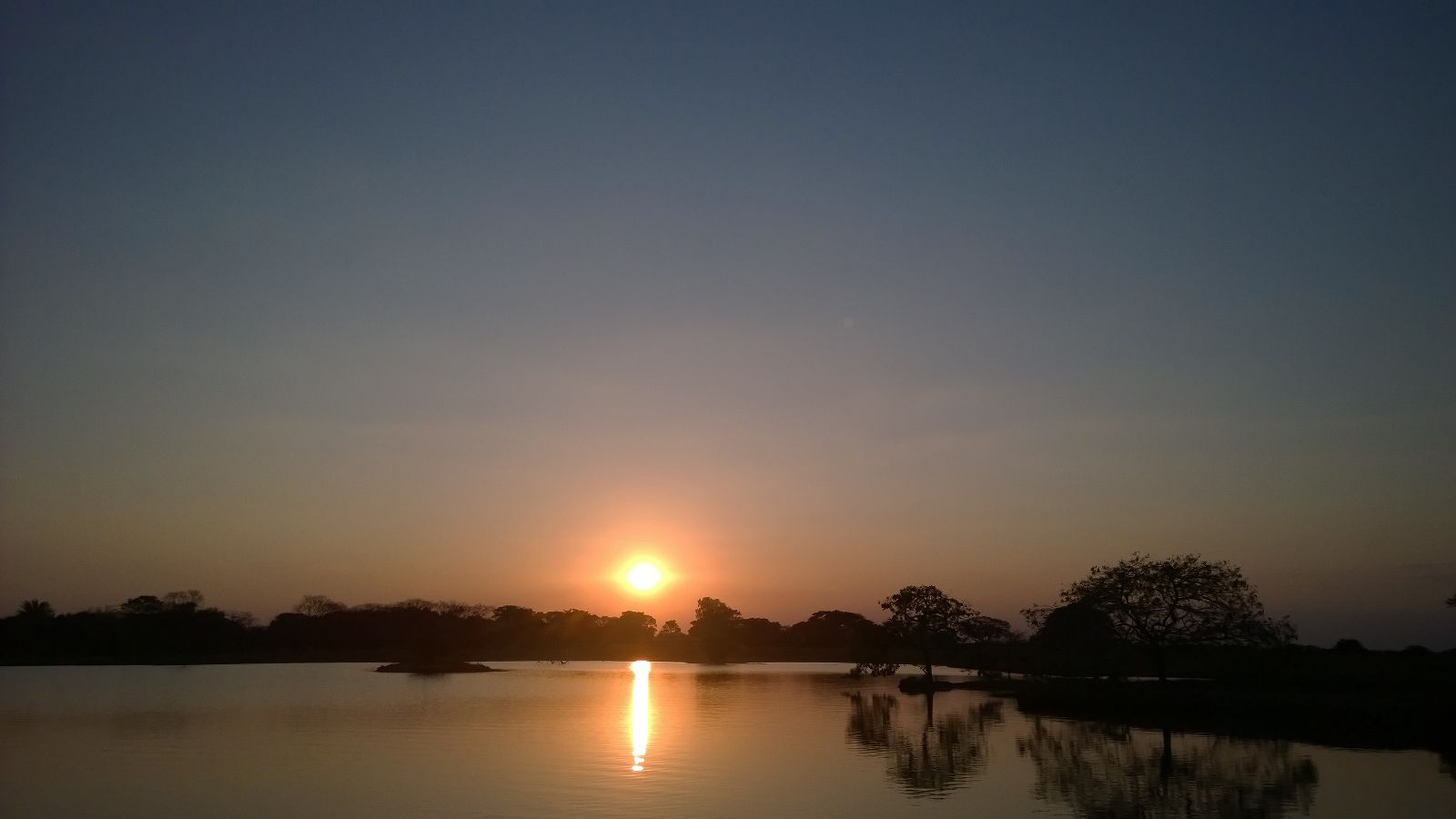 Sunset over a savanna creek in the Eastern Plains of Casanare